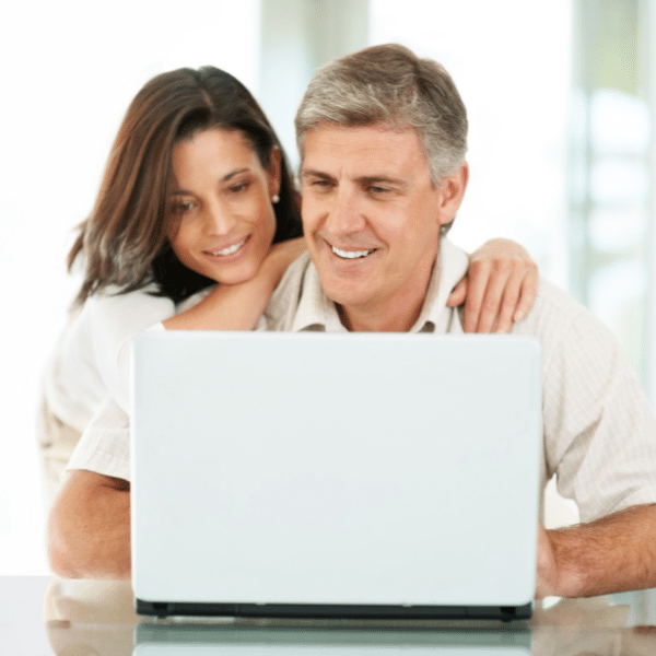 mature couple on the computer running an online affiliate marketing business